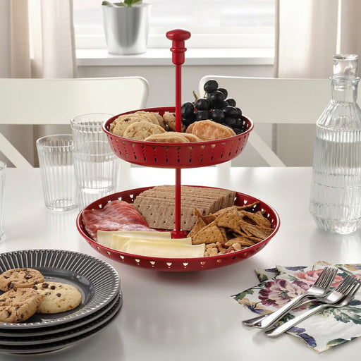 "Elegant Red IKEA GARNERA Serving Stand with Snacks, Set on a Dining Table"