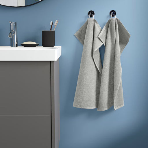 Grey hand towel from IKEA LUDDVIAL collection, size 40x60 cm, hanging on rack-50579871