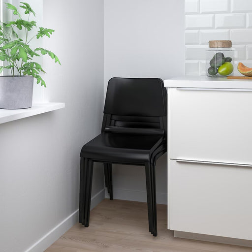 Black IKEA TEODORES Chair in a bright room, adding elegance and functionality to the space-00530622