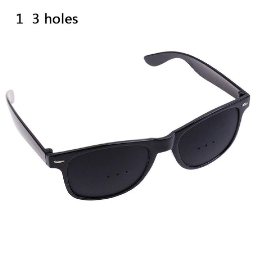 Unisex pinhole glasses for natural vision care and eyesight improvement.