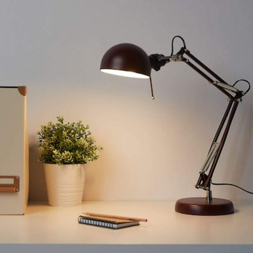 A dark red IKEA work lamp with a sleek and modern design, featuring an adjustable arm and a cone-shaped shade40457295