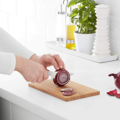 A flexible silicone cutting board with a textured surface, ideal for preparing dough or rolling out pastry.