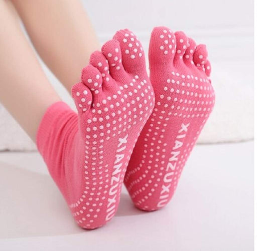 A pair of professional non-slip breathable yoga socks with five toe design.