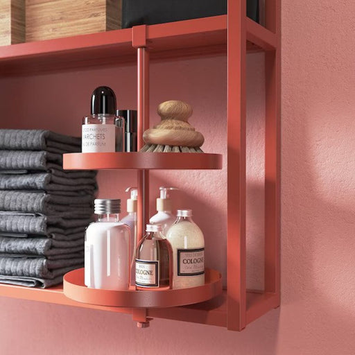 A picture of a bathroom with an IKEA swivel shelf installed, showcasing toiletries, towels, and other bathroom essentials.