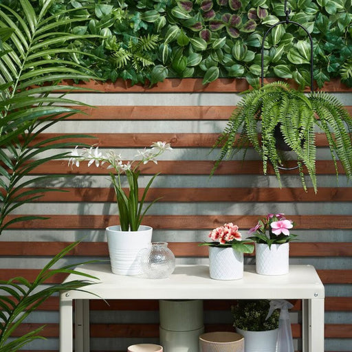 Add some greenery to your walls with IKEA's artificial wall mounted plant, measuring 26x26 cm, perfect for elevating your decor both inside and outside.  Digital Shoppy 70546573  