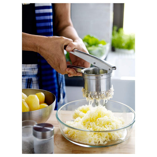  Close-up of the Potato Press in use - "Create perfectly smooth mashed potatoes in minutes with the IKEA Potato Press. 80191915